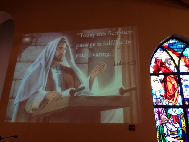 slide of Jesus and his Holy Words on a church wall