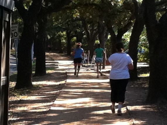 Runners and walkers on Rice University campus trail