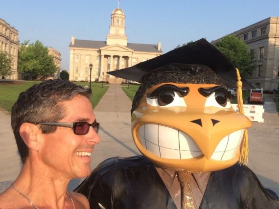 jeff noel with University of Iowa's Herky mascot