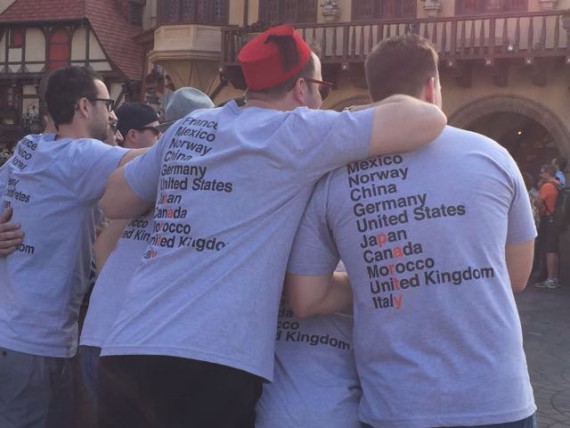 Group of young men drinking around the world at Epcot.