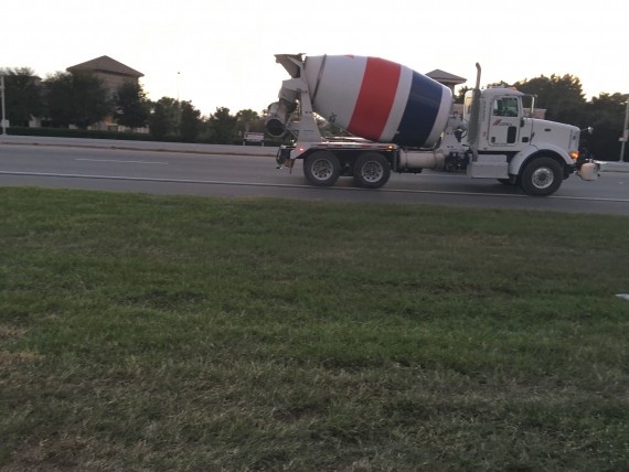 white, red, and blue cement truck