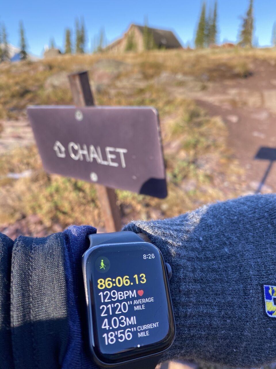 Chalet sign and AppleWatch time/distance display