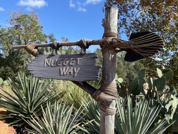 Unique Disney World signage with a shovel