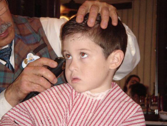 Child getting haircut at Magic Kingdom