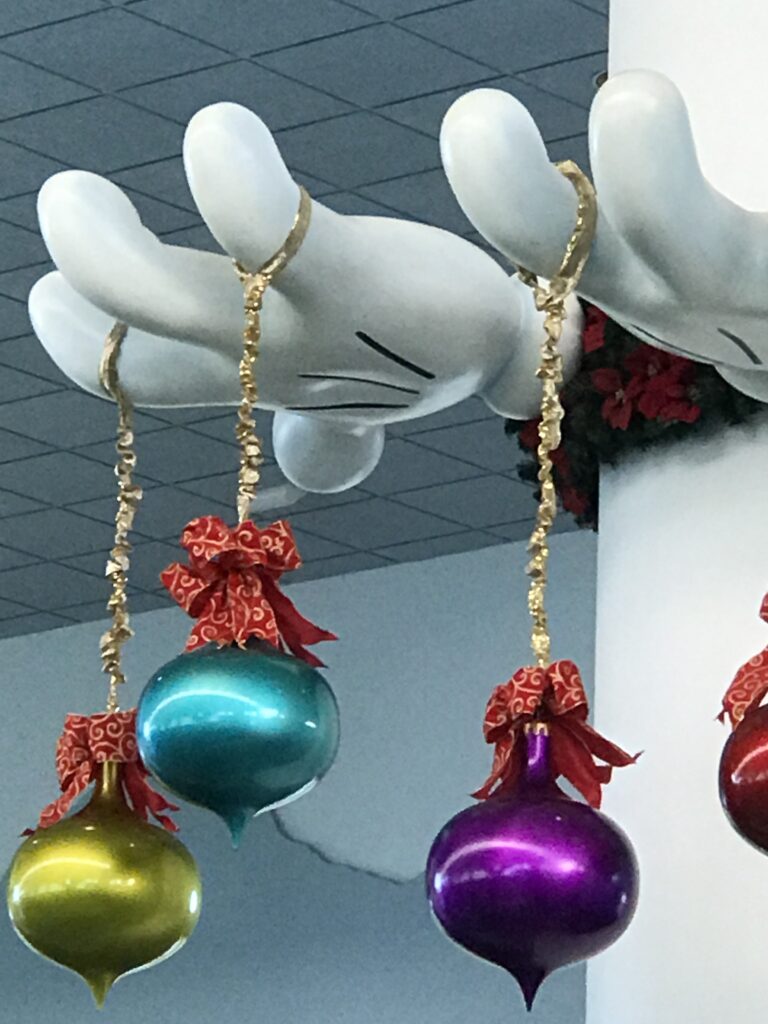 Large Christmas ornaments at Disney Cruise Line terminal lobby