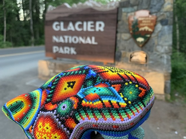 colorful bead design next to National Park sign