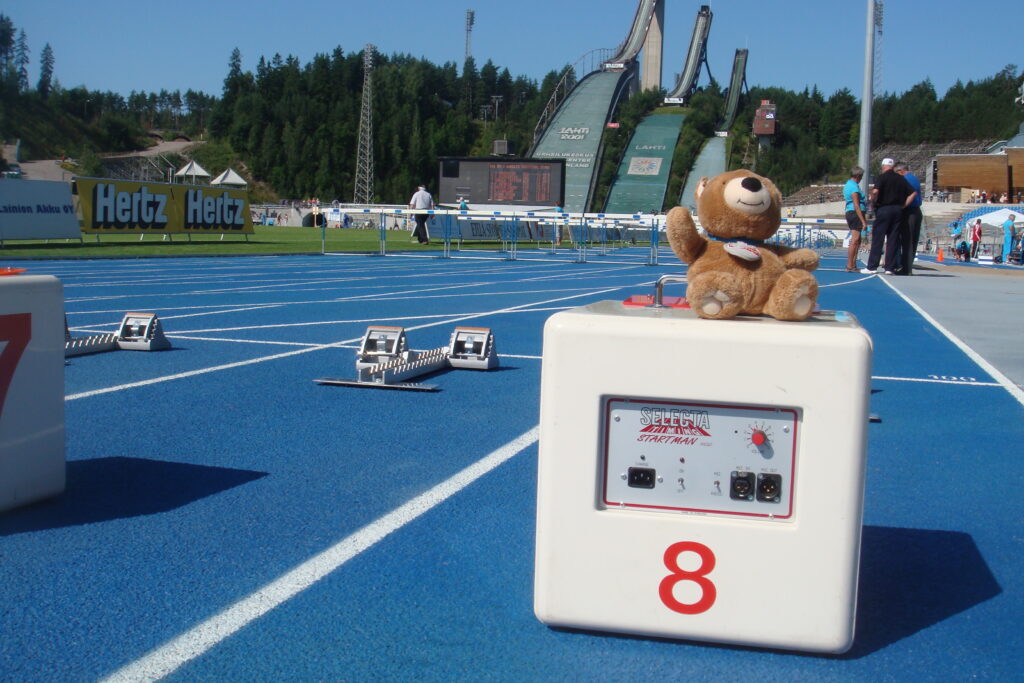 teddy bear at track starting line