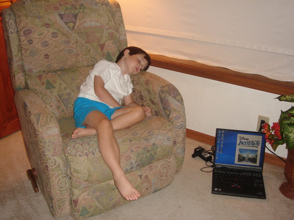 child asleep on a chair