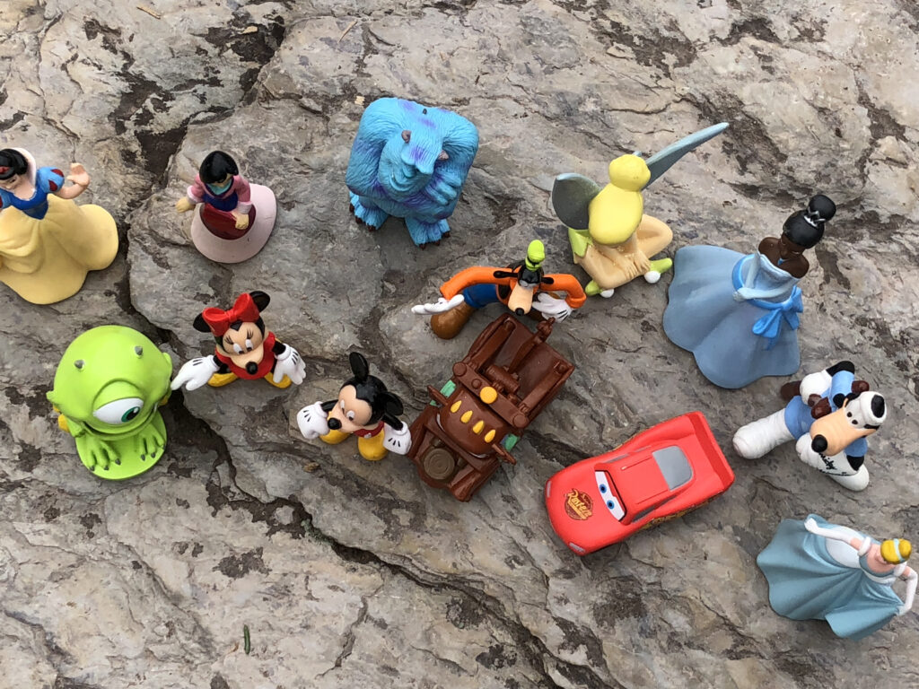 Disney toys on a rock