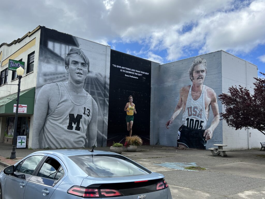 Steve Prefontaine murals on side of build