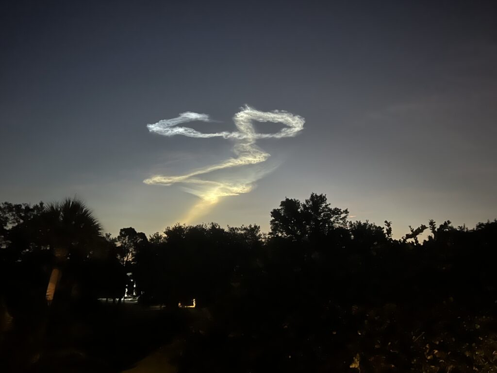 Rocket launch smoke trail at dawn