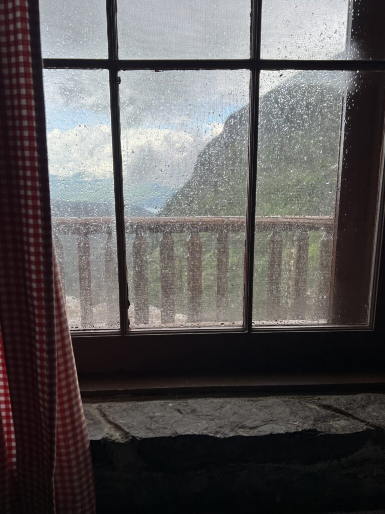 Rainy window in the mountains