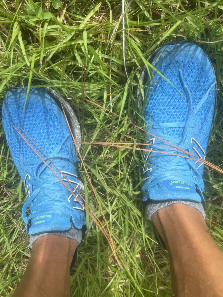 Blue running shoes on someone’s feet