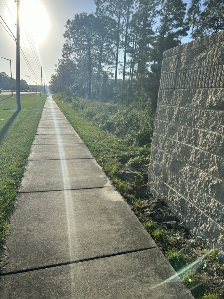 Long sidewalk next to highway