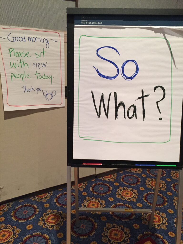 flip chart with 'so what' written on it