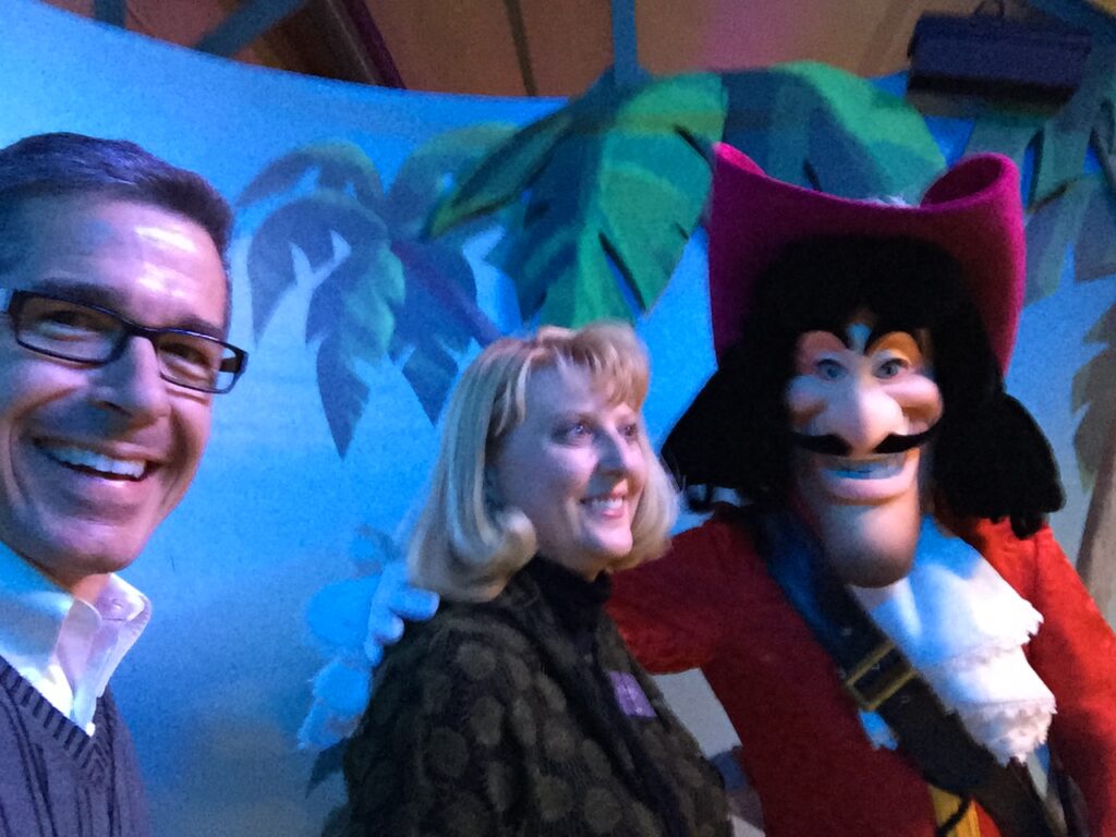 couple posing with Captain Hook