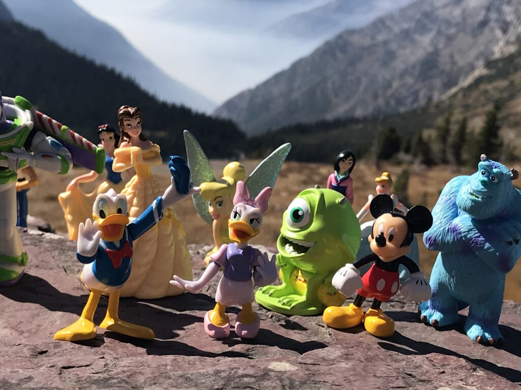 Disney character figurines in the mountains