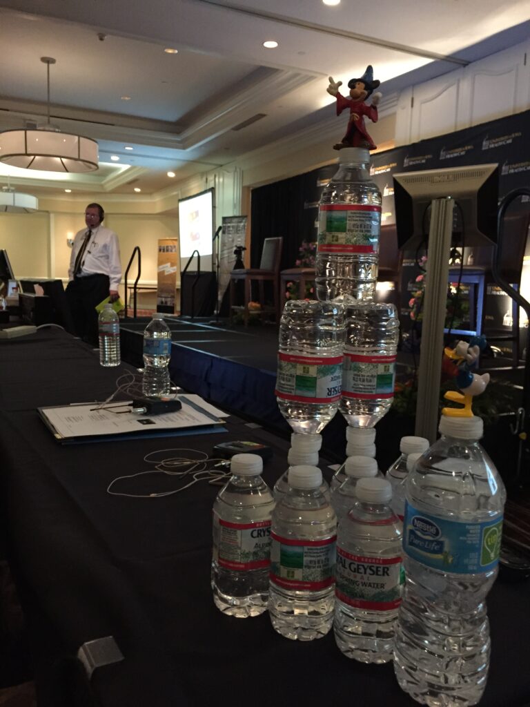 Water bottles stacked in conference room