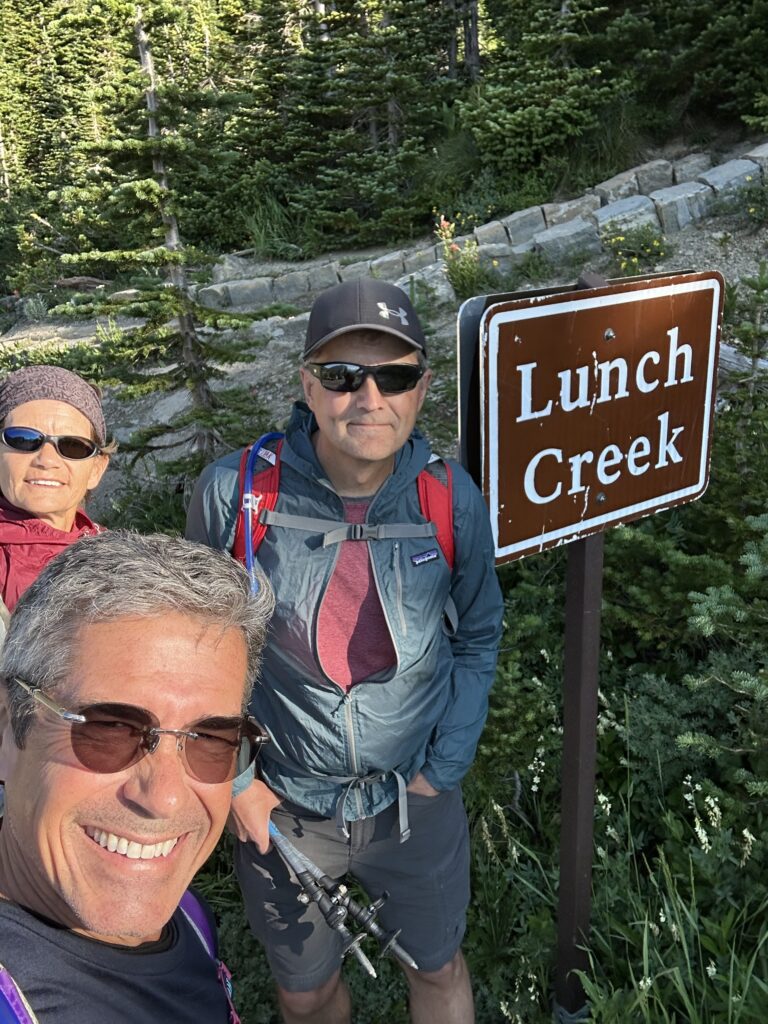 Three hikers at the trail head