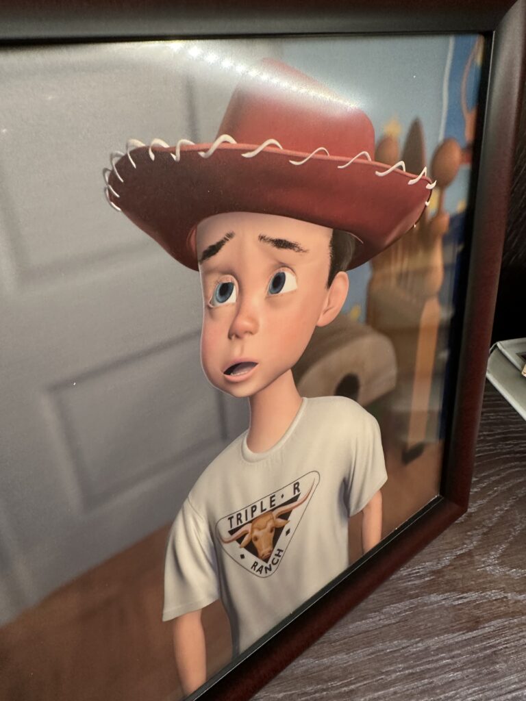 Picture of Andy from Toy story with a cowboy hat on