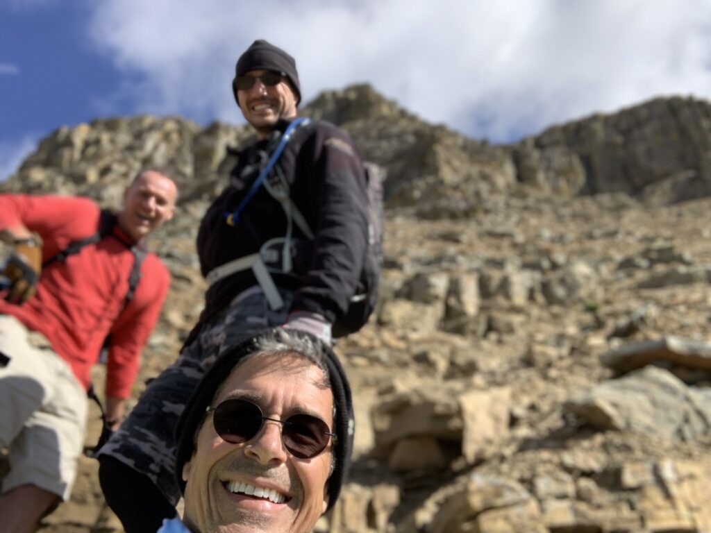 Three hikers on a mountain 