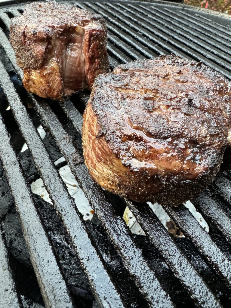 Two grilled fillet mignon steaks