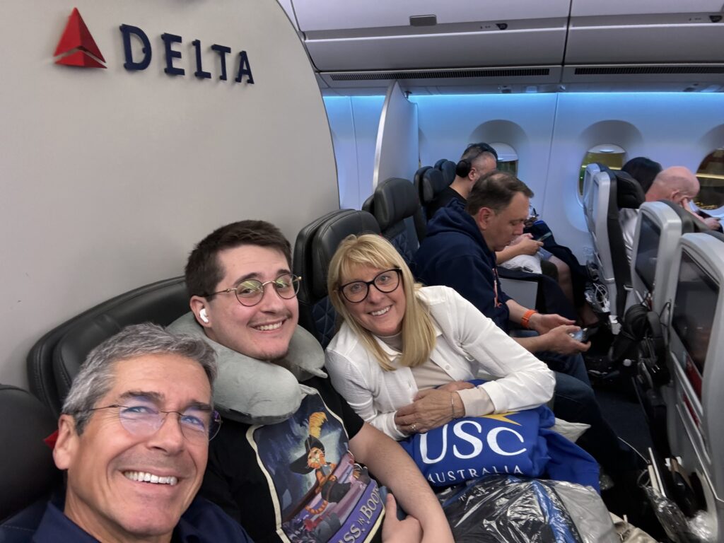 Three adults on a plane