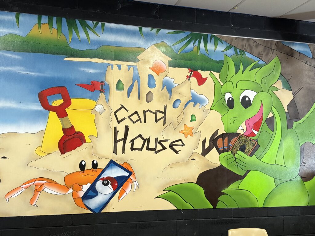 The card house logo on a wall