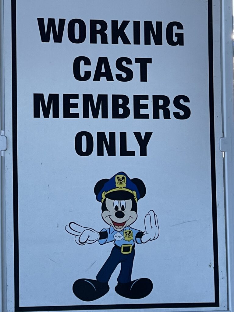 Disney cast members working sign