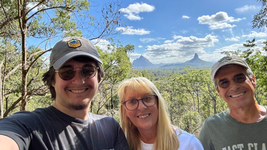 Three adults in the mountains