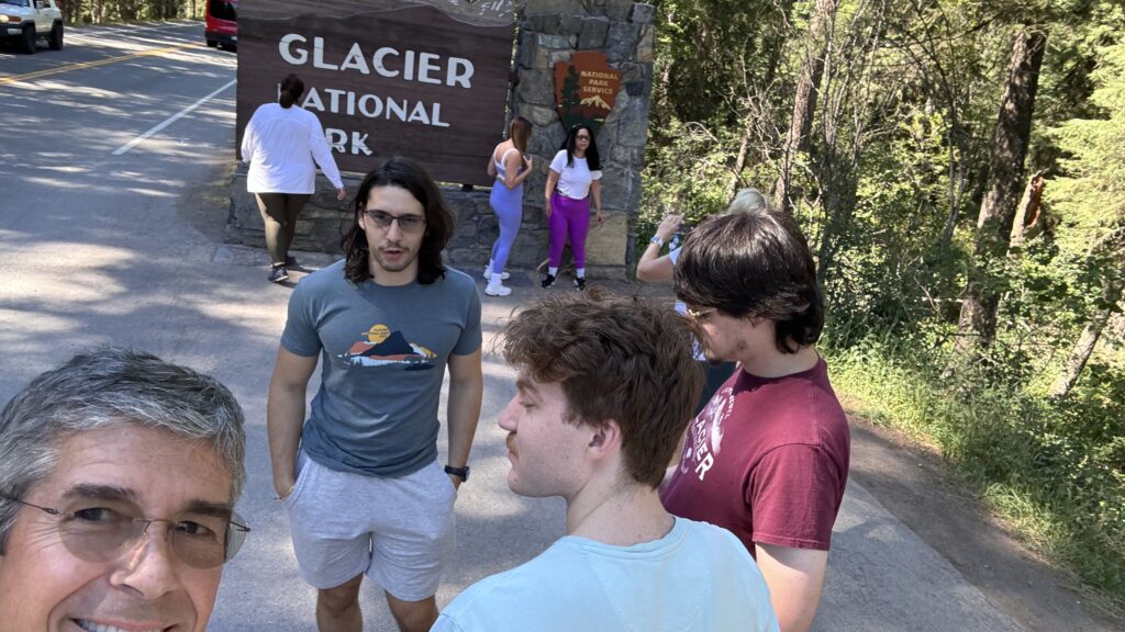 people near a National Park sign