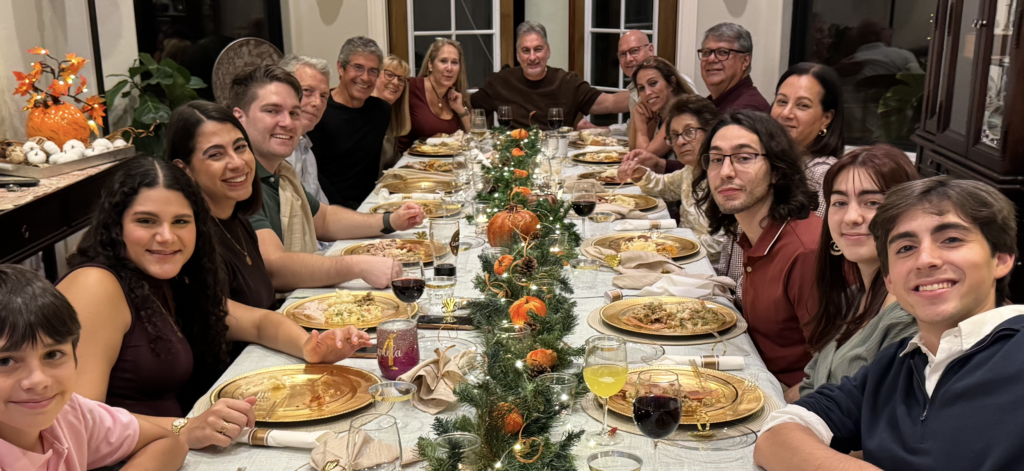 Large family gathered at their dinner table