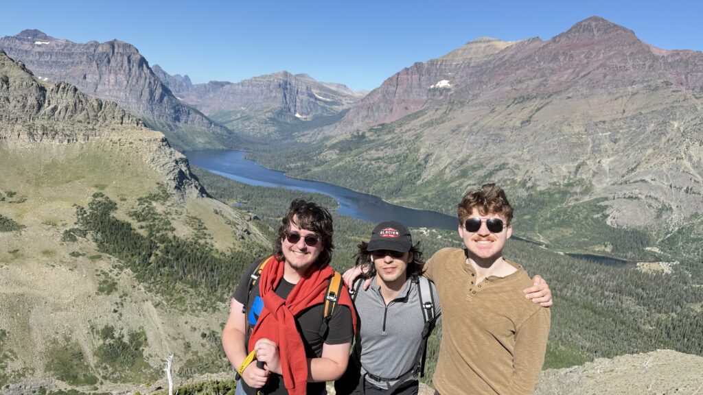 three men in the mountains
