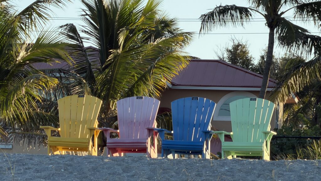 four colorful beach chairs